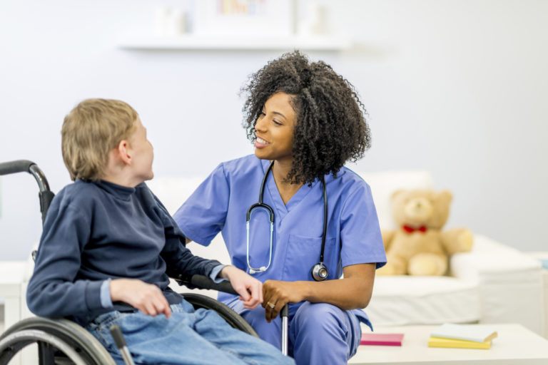 A child with special needs due to chromosome 8P inversion duplication syndrome with a doctor.